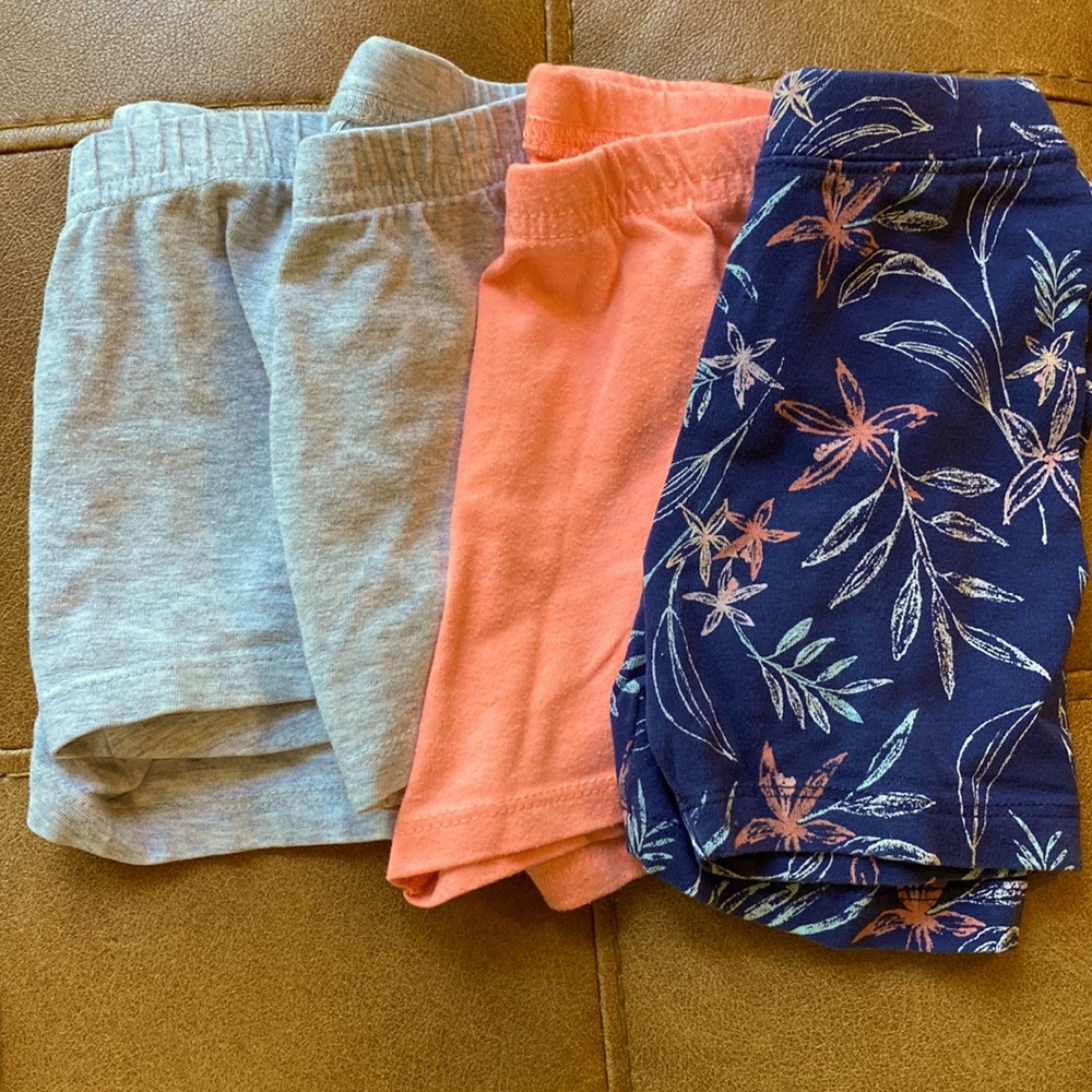 Set of 4 biker shorts: 2 gray, 1 coral, 1 navy flower pattern